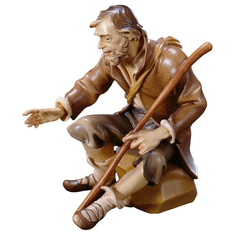 Seated shepherd with stick