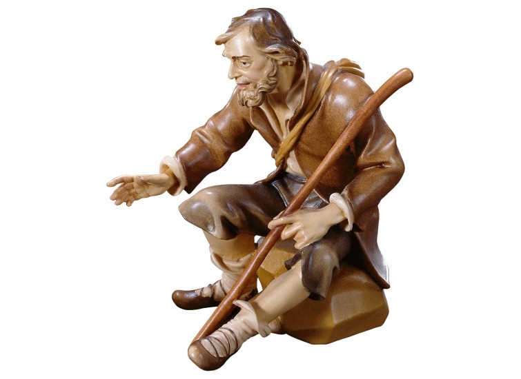 Seated shepherd with stick