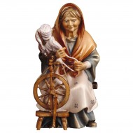 Old peasant woman with spinning wheel