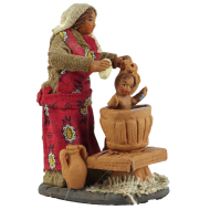 Woman washing baby in terracotta 10 cm